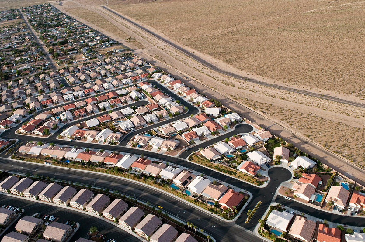 Picture of a dense subdivision bordering undeveloped desert in Las Vegas, Nevada. Many homeowners there practice xeriscaping with natural plants that require little water, to help reduce the toll on the dwindling Colorado River