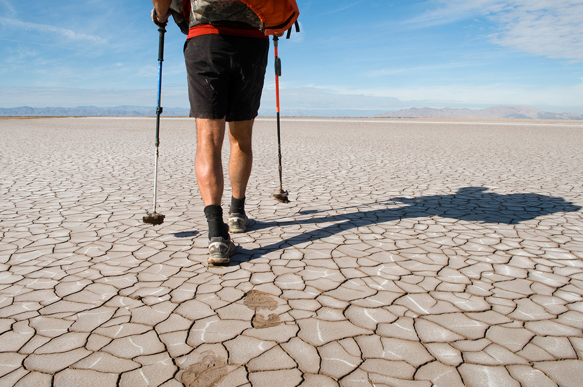 Picture of Jonathan Waterman trekking across the dry Colorado River Delta