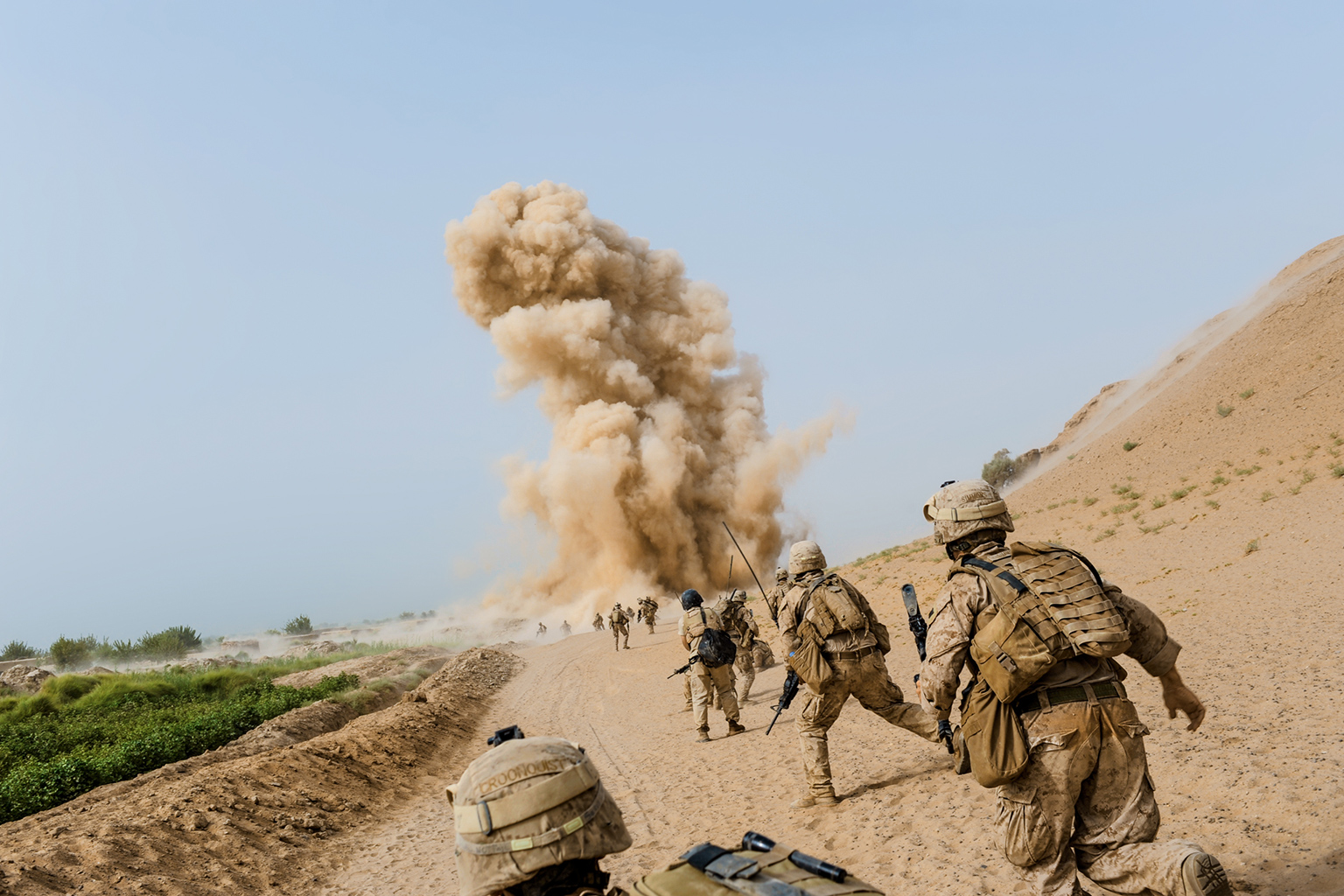 Picture of Marines in Afghanistan looking toward an explosion