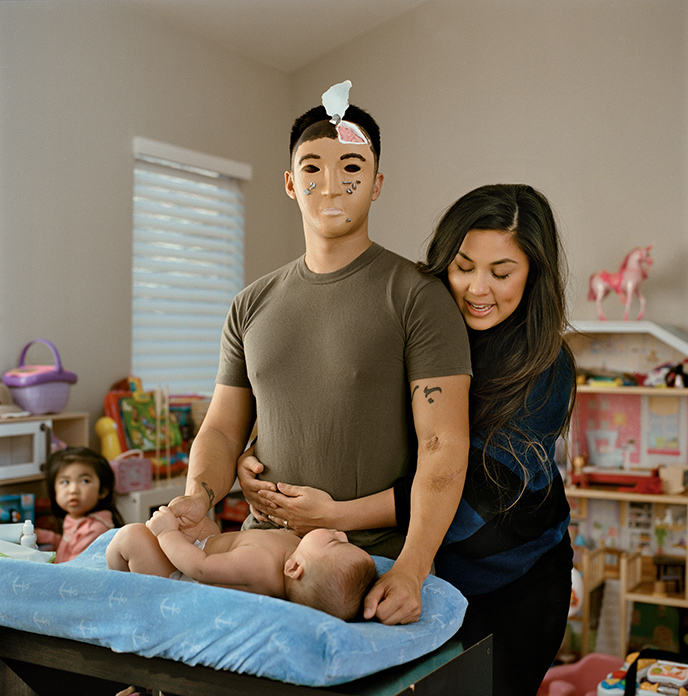 Picture of Marine Gunnery Sgt. Aaron Tam and his family